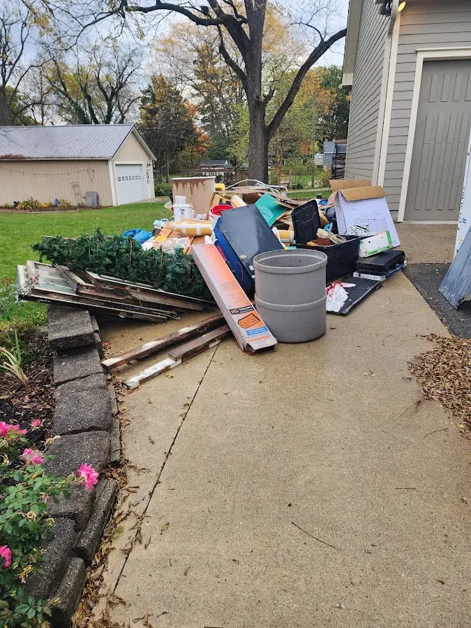 Dumpster being loaded with debris for 3 Yard Dumpster Rental in Wahiawa